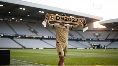 York defender completes shock Champions League move after helping the Minstermen to a 1st-place finish in the National League